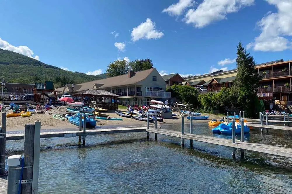 Docks and canoes and kayaks on the beach